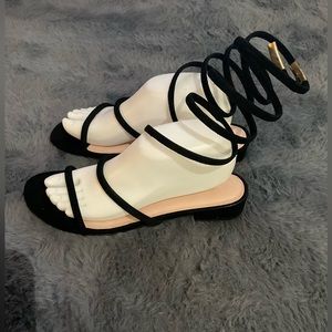 Black strappy sandals in a size 9